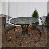 L03. Woodard style outdoor table and chairs. (One of two sets.) 